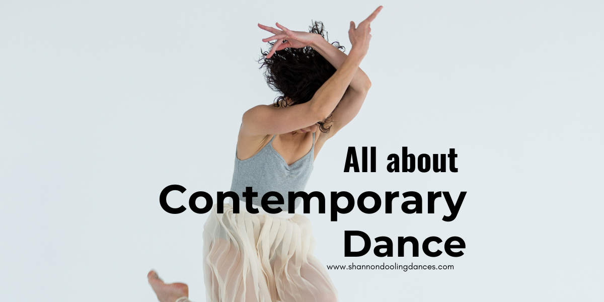 A photo of a white female presenting dancer in a white skirt and grey top. She has her arms above her head and a leg tucked up in a jump. Black text reads, "All about contemporary dance"